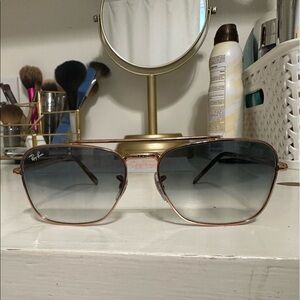 Ray-bans with blue tint lenses and copper frames